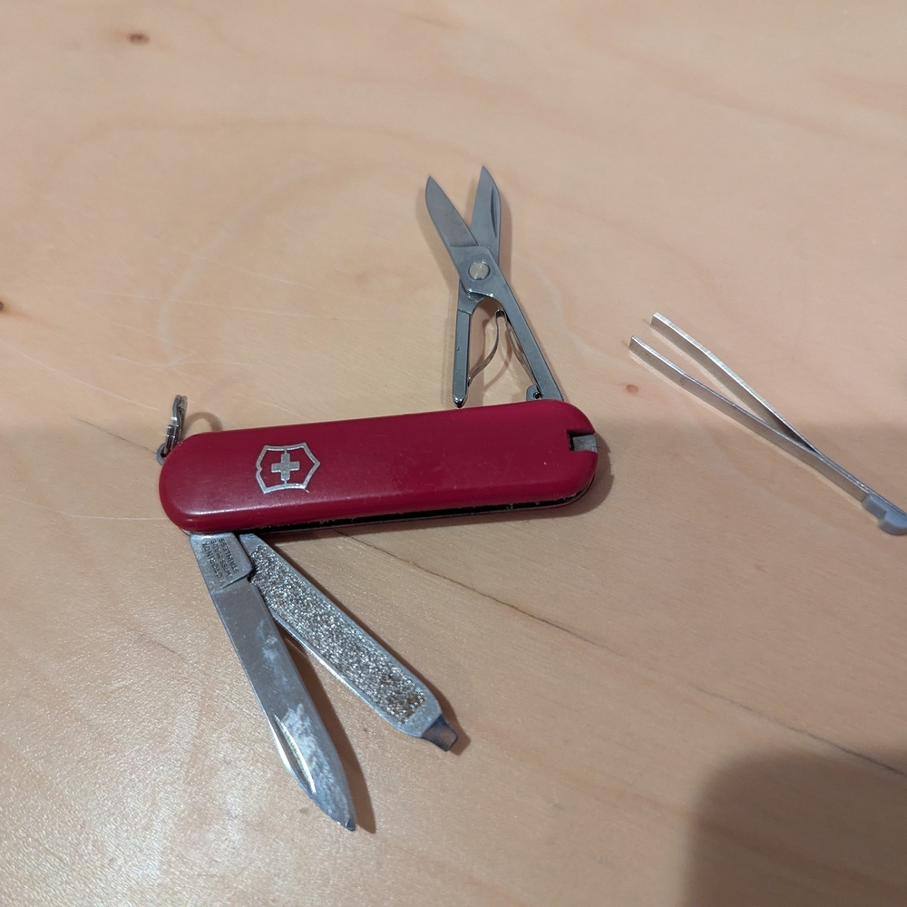 Victorinox Red Multi-Tool with Scissors and Tweezers